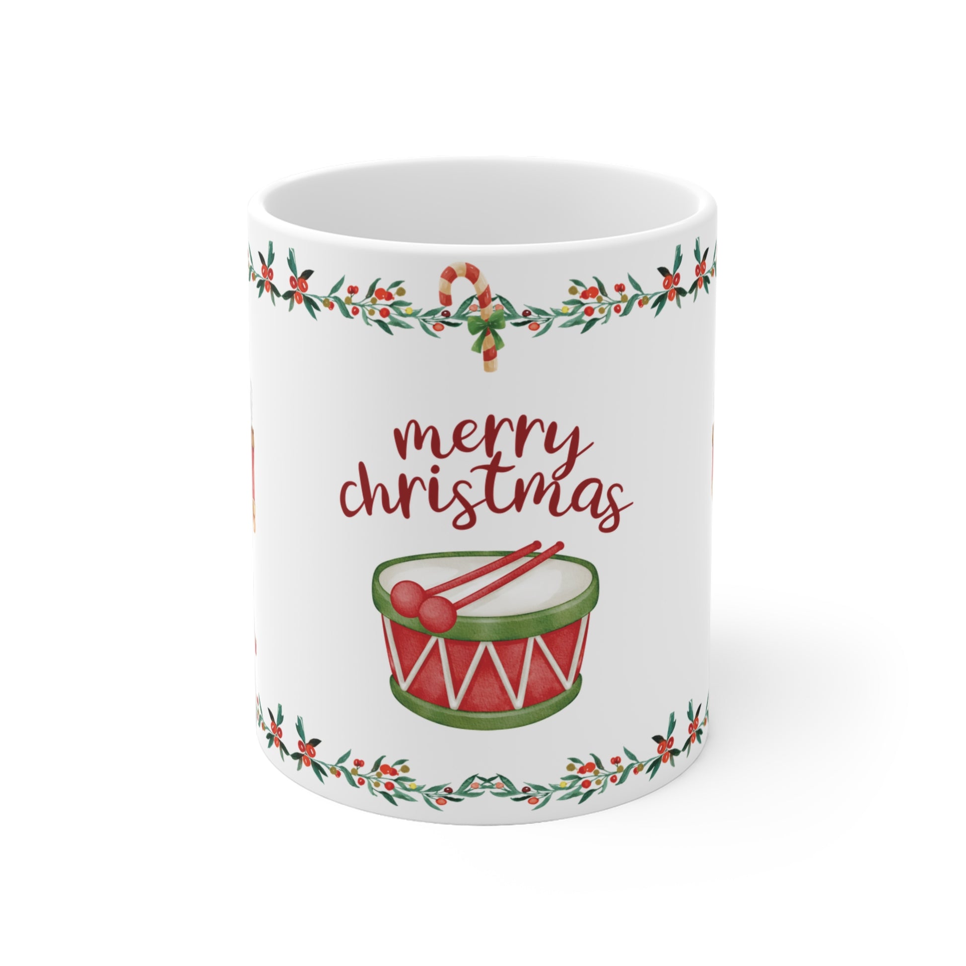 White mug with Christmas design featuring a drum and 'merry christmas' text on a white background
