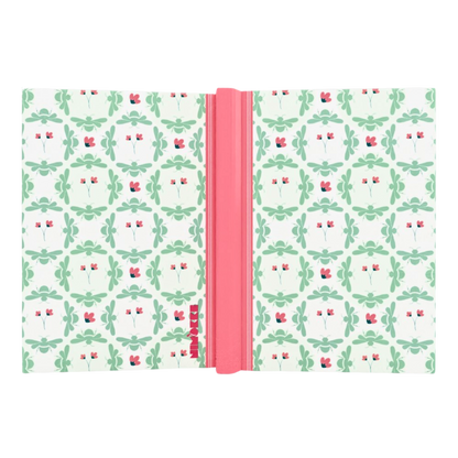 Close-up of hardcover notebook with nature-inspired pattern