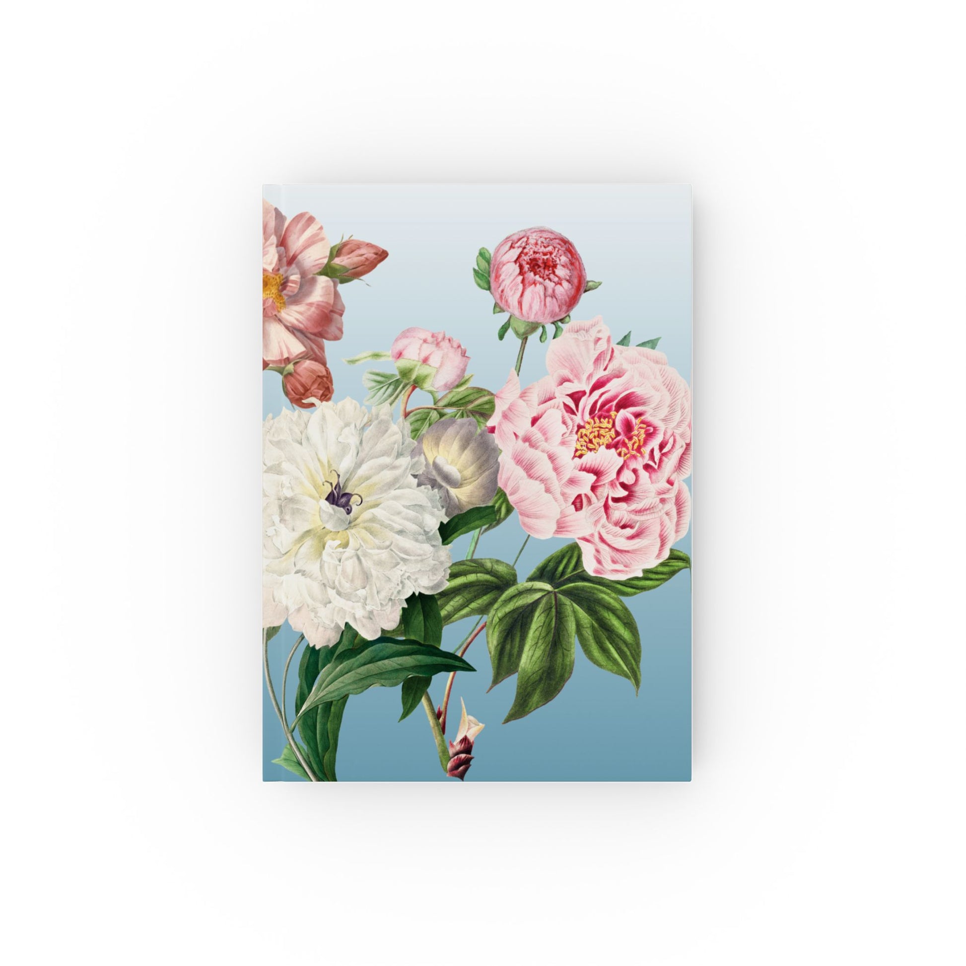 Floral design Notebook on a blue background with pink, white, and green flowers.