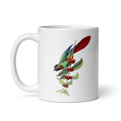 A white ceramic mug with a colorful illustration of a parakeet bird perched on a branch with leaves and berries.